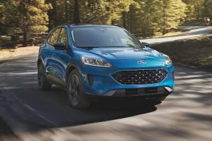 A blue 2022 Ford Escape driving on a road.