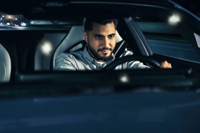 Person sitting in the driver’s seat of a parked 2024 Ford Mustang® coupe | Coughlin Ford of Pataskala in Pataskala OH